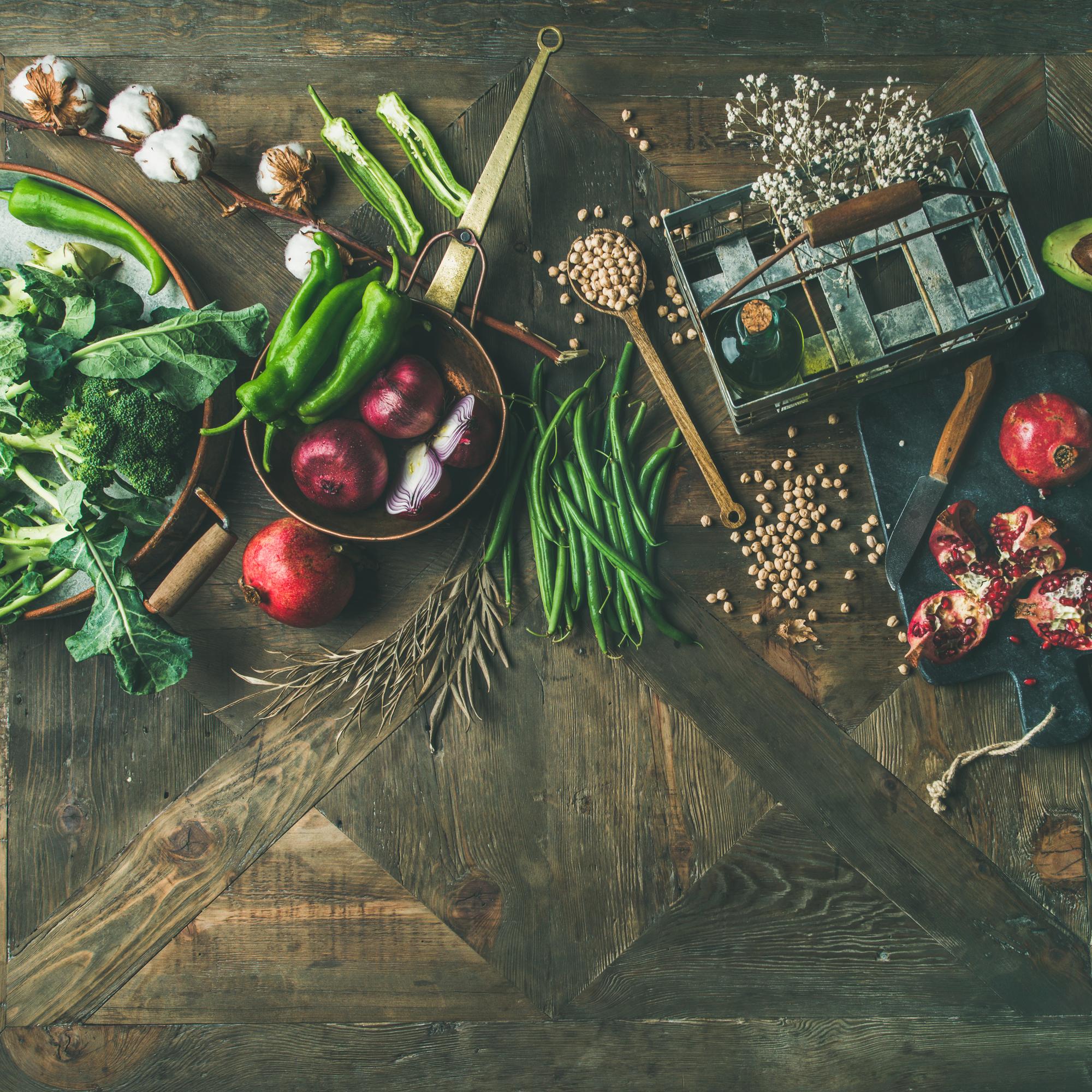 ingredients on wooden board: root vegetables and herbs